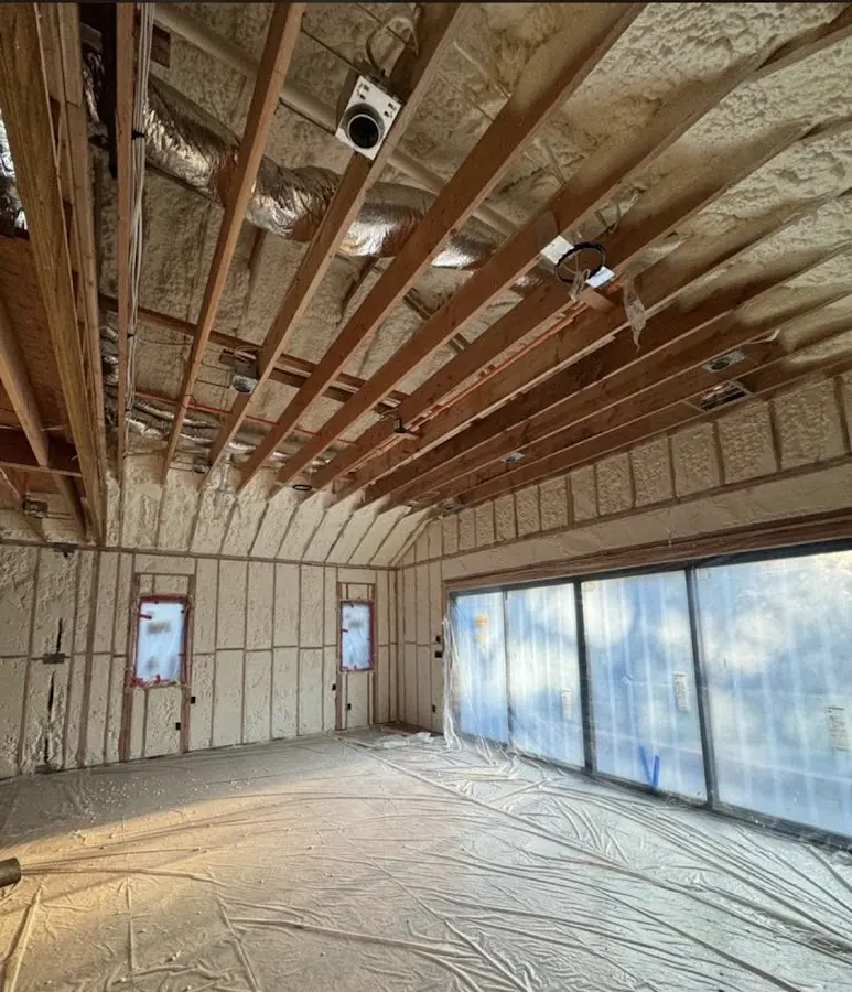 Interior walls and ceiling insulated with spray foam during new construction in Los Alamitos